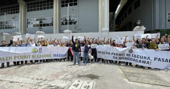 Workers from University of Santo Tomas Philippines Rally Against Unjust Health Ordinance